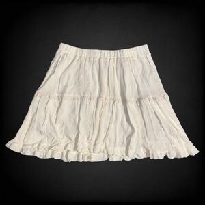 Cider Solid Ruffle Tiered Mini Skirt in Cream